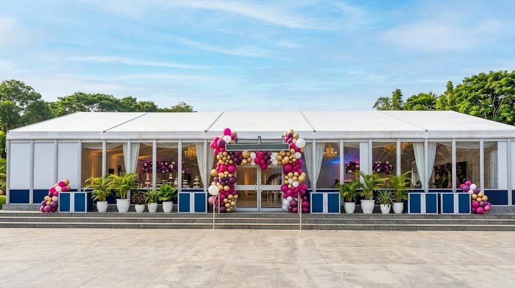 Balloon garland in magenta, gold and white framing the entrance